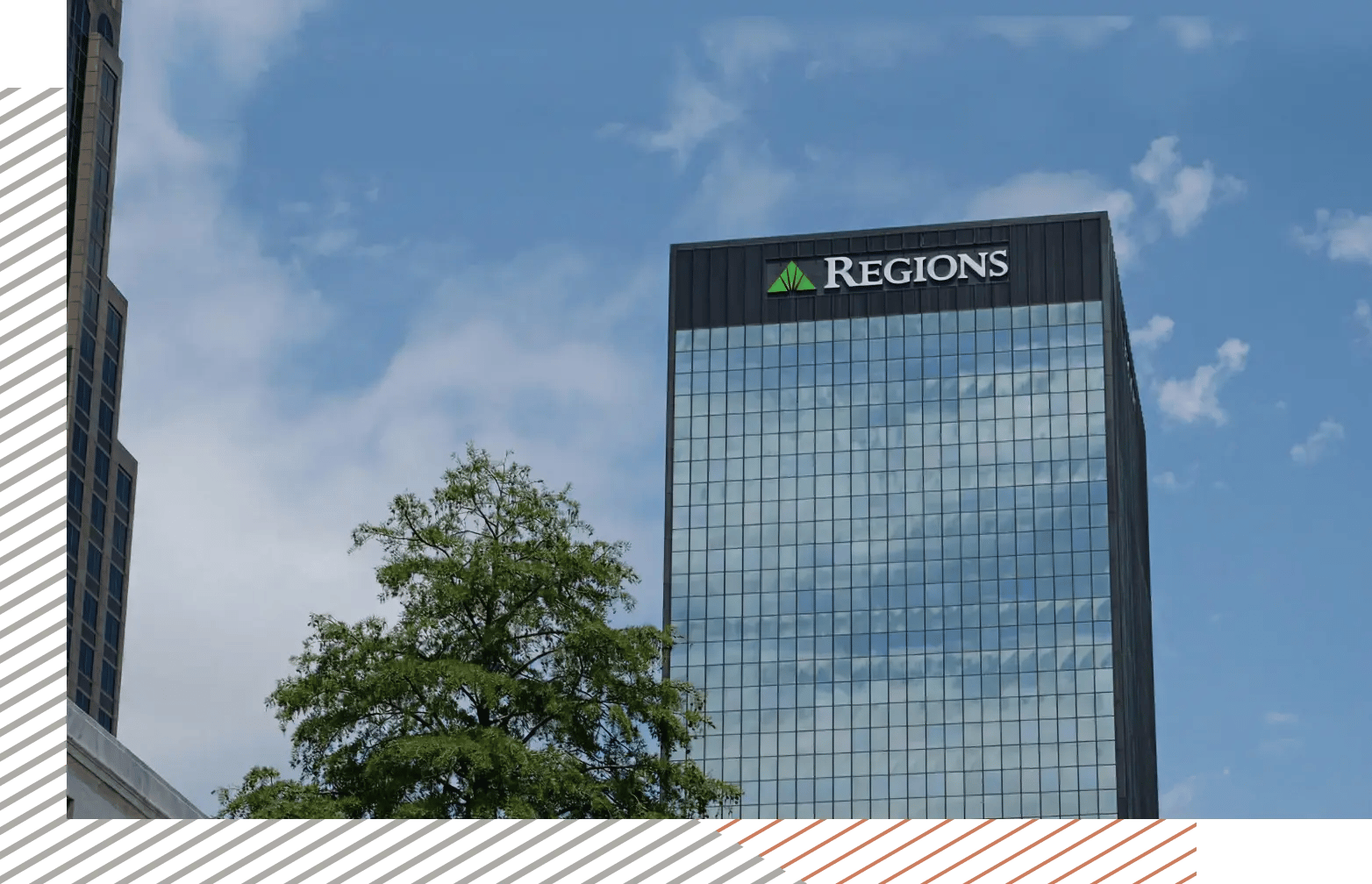 Regions Bank building with blue glass facade against a clear sky