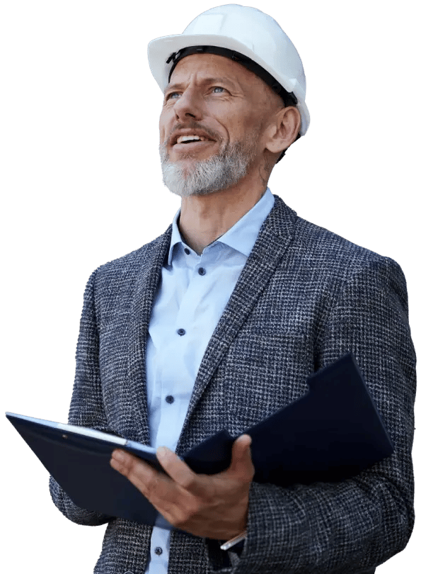 A man in a hard hat and formal attire holds a clipboard, appearing to review documents, against a black background.